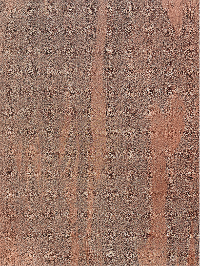 Intonachino textured plaster in terracotta tones