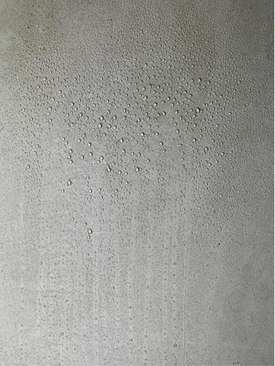 Tadelakt plaster shower wall with water droplets
