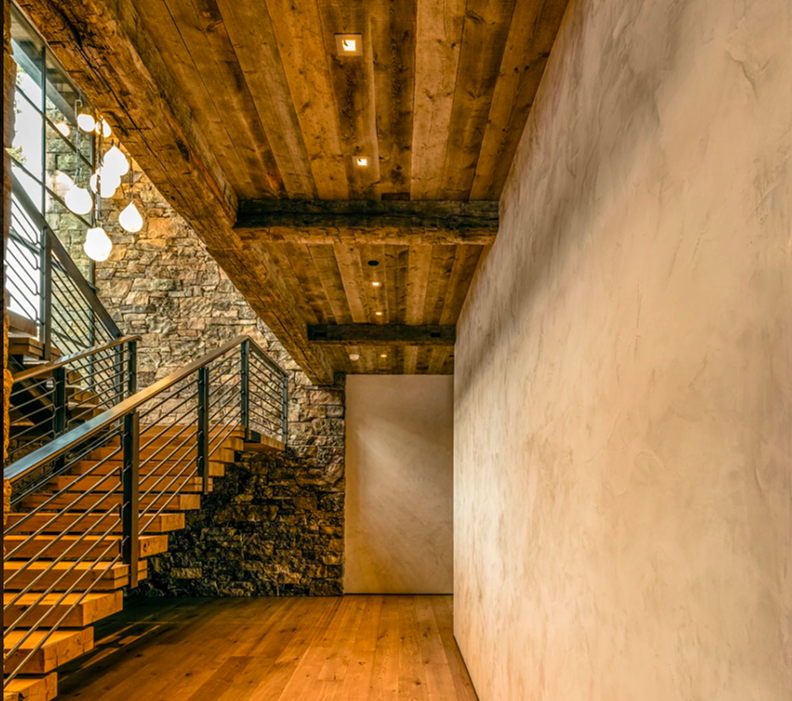 Warm, minimal interior with handcrafted plaster walls